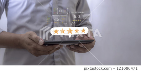 Consumer Satisfaction, Young Man hand using laptop with five star to review and give 5 stars Consumer Satisfaction, Young Man hand using laptop with five star to review and give 5 stars 121086471