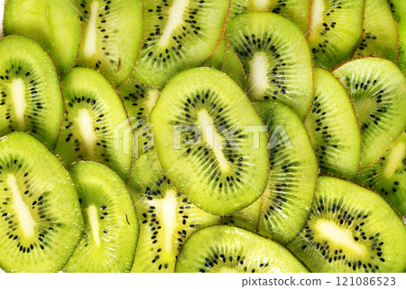 Kiwi fruit slices. Fresh kiwi total background 121086523