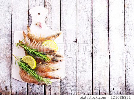 Uncooked Raw peeled tiger white shrimp prawn. Top view. 121086531