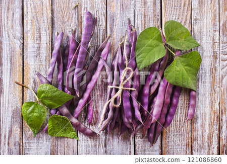raw bean on light wooden table 121086860