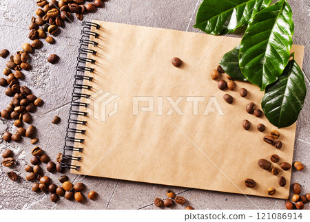 Roasted coffee beans with note on a table 121086914