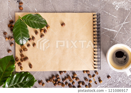 black coffee in coffee cup with coffee bean and on stone table 121086917