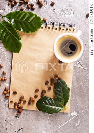 black coffee in coffee cup with coffee bean and on stone table black coffee in coffee cup with coffee bean and on stone table 121086918