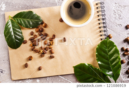 black coffee in coffee cup with coffee bean and on stone table black coffee in coffee cup with coffee bean and on stone table 121086919
