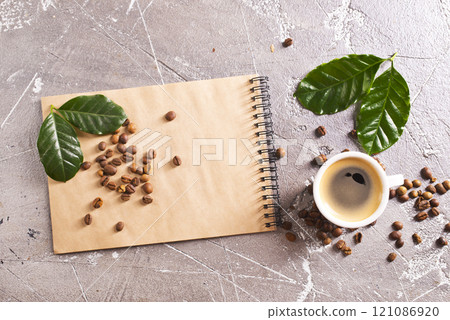 black coffee in coffee cup with coffee bean and on stone table 121086920