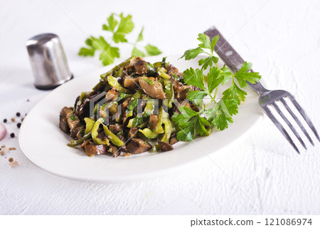 Eggplants with green tomatoes, paprika, carrot, onion and garlic. 121086974