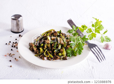 Eggplants with green tomatoes, paprika, carrot, onion and garlic. 121086976
