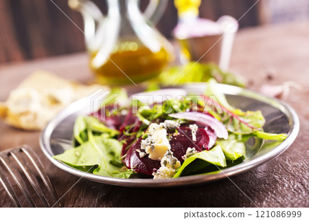 Tasty salad of beetroot, cheese and nuts. Copy space. 121086999