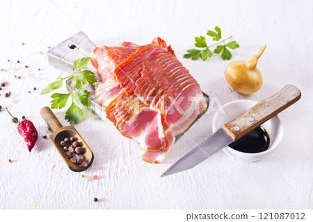 smoked bacon slices for hot pot on a table 121087012