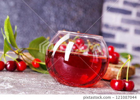 Fresh juice made of sweet cherries in glass Fresh juice made of sweet cherries in glass 121087044
