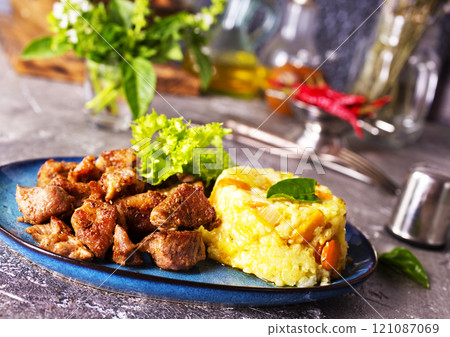 boiled rice with fried meat on plate boiled rice with fried meat on plate 121087069