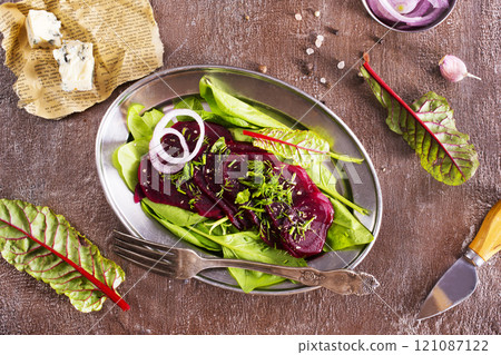 salad from boiled beet on dark background. 121087122
