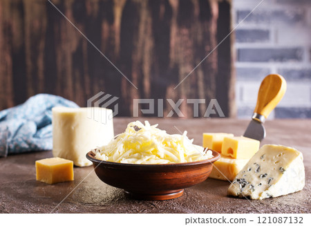 grated cheese in bowl, mix from cheese grated cheese in bowl, mix from cheese 121087132