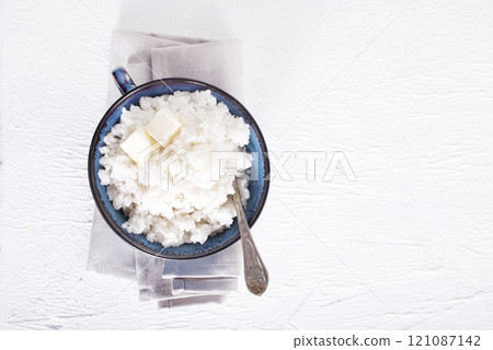 Rice porridge or pudding in a bowl for a breakfast. Rice porridge or pudding in a bowl for a breakfast. 121087142