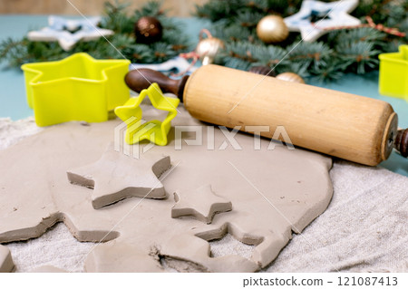 Carving Christmas toys out of clay 121087413