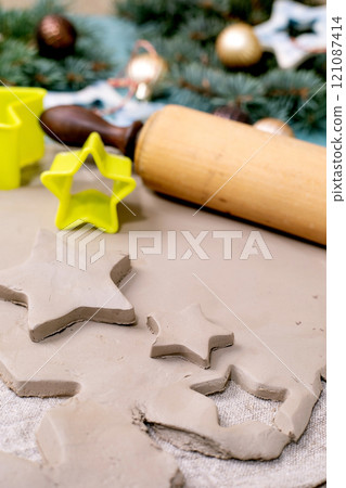 Carving Christmas toys out of clay Carving Christmas toys out of clay 121087414