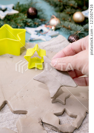 Carving Christmas toys out of clay Carving Christmas toys out of clay 121087416