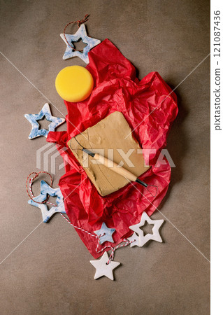 Piece of raw clay as a gift 121087436