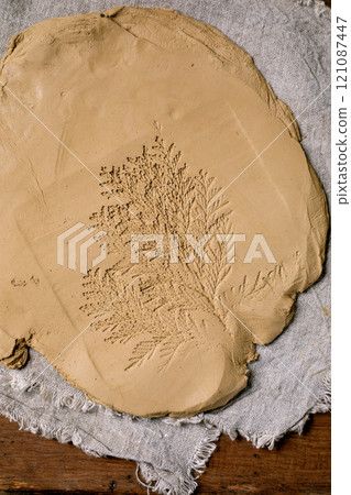 Decorating of raw clay ceramics Decorating of raw clay ceramics 121087447