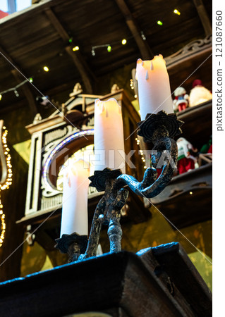 A huge candlestick and candles on it. 3 candles on a candlestick, New Year A huge candlestick and candles on it. 3 candles on a candlestick, New Year 121087660