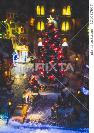 A Christmas diorama. A Christmas tree on a snowy night. A New Year's tale A Christmas diorama. A Christmas tree on a snowy night. A New Year's tale 121087667