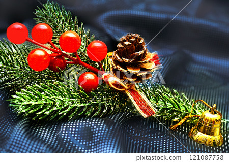 New Year. Branch of Christmas trees with cones,berries.Bell 121087758
