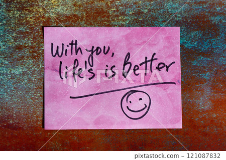 Love note on a post-it or self-adhesive paper. 121087832