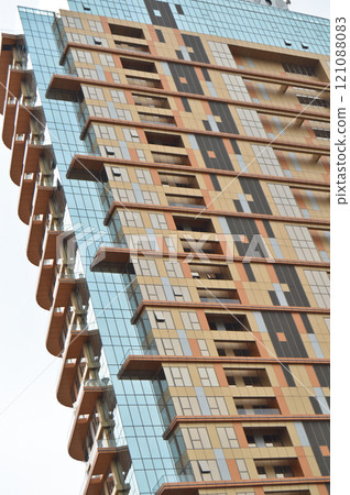 Modern glass building in the city center, business center with blue sky 121088083