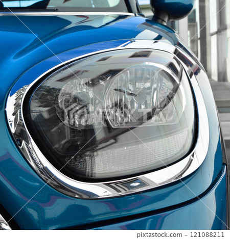 Detail of blue car headlights lamp, modern car front lamp 121088211