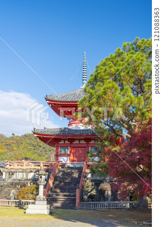 Autumn in Kyoto: Daikakuji Temple - Heart Sutra Pagoda surrounded by autumn leaves Autumn in Kyoto: Daikakuji Temple - Heart Sutra Pagoda surrounded by autumn leaves 121088363
