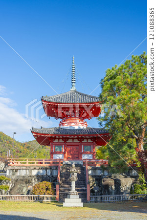 Autumn in Kyoto: Daikakuji Temple - Heart Sutra Pagoda surrounded by autumn leaves 121088365