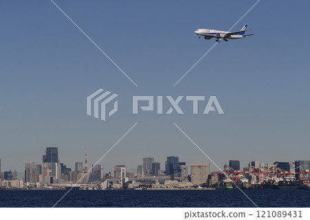 Tokyo city center and airplane 121089431