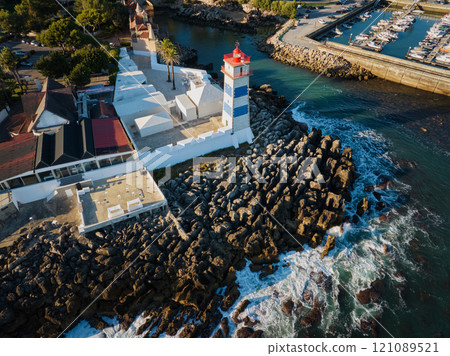 Aerial view of Santa Marta lighthouse and Cascais marina with Cascais cityscape 121089521