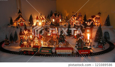 Christmas Decorations on a Window of a Building with a Toy Ornament Christmas Decorations on a Window of a Building with a Toy Ornament 121089586
