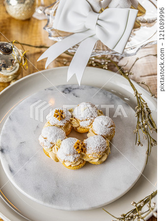Cream puffs with praline cream filling Cream puffs with praline cream filling 121089996