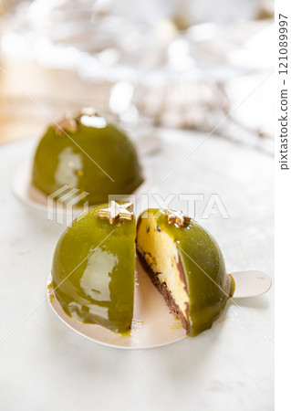 Delicious pistachio and chocolate dome cakes Delicious pistachio and chocolate dome cakes 121089997