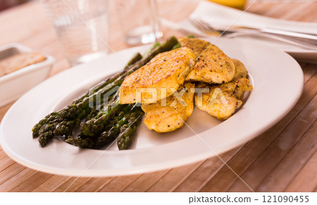 Dietary meal rich in protein. Stir fried chicken breast and green asparagus Dietary meal rich in protein. Stir fried chicken breast and green asparagus 121090455