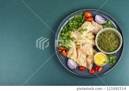 Fresh herb marinated chicken meat. Fresh herb marinated chicken meat. 121092514