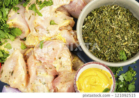 Raw chicken medallions. 121092515