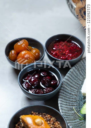 Variety of jams served on breakfast table setting Variety of jams served on breakfast table setting 121092573