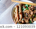 One bowl of traditional Indonesian chicken noodles. This food has a rich, spiced taste. 121093039