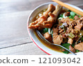 One bowl of traditional Indonesian chicken noodles. This food has a rich, spiced taste. 121093042