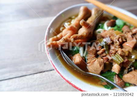 One bowl of traditional Indonesian chicken noodles. This food has a rich, spiced taste. 121093042