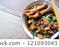 One bowl of traditional Indonesian chicken noodles. This food has a rich, spiced taste. 121093043