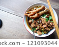 One bowl of traditional Indonesian chicken noodles. This food has a rich, spiced taste. 121093044