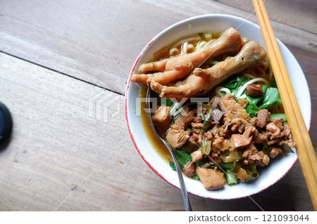 One bowl of traditional Indonesian chicken noodles. This food has a rich, spiced taste. 121093044