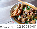 One bowl of traditional Indonesian chicken noodles. This food has a rich, spiced taste. 121093045