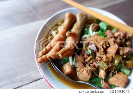 One bowl of traditional Indonesian chicken noodles. This food has a rich, spiced taste. 121093045