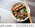 One bowl of traditional Indonesian chicken noodles. This food has a rich, spiced taste. 121093141
