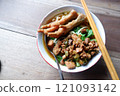 One bowl of traditional Indonesian chicken noodles. This food has a rich, spiced taste. 121093142